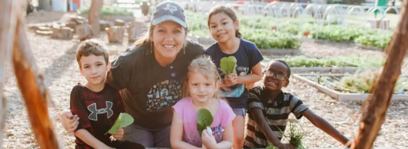 Farmer Kim Aman and Moss Haven Elementary Farm students 